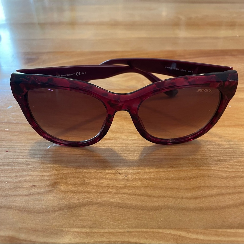Jimmy Choo sunglasses in very good condition. Pinkish purple frames .